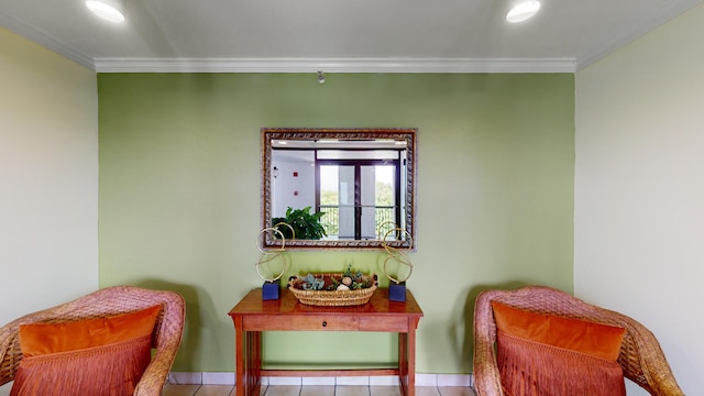 living area featuring crown molding