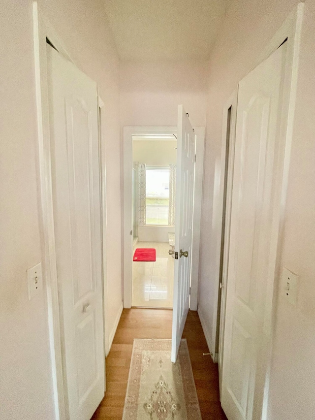 hallway featuring hardwood / wood-style flooring