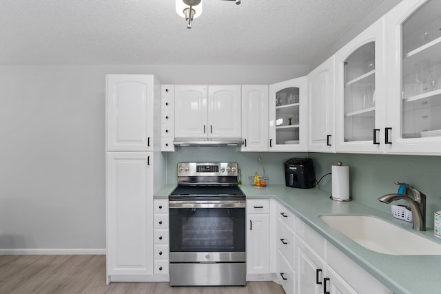 kitchen with stainless steel range with electric stovetop, a textured ceiling, light hardwood / wood-style flooring, sink, and white cabinets