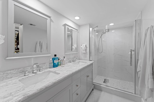 bathroom featuring vanity and walk in shower