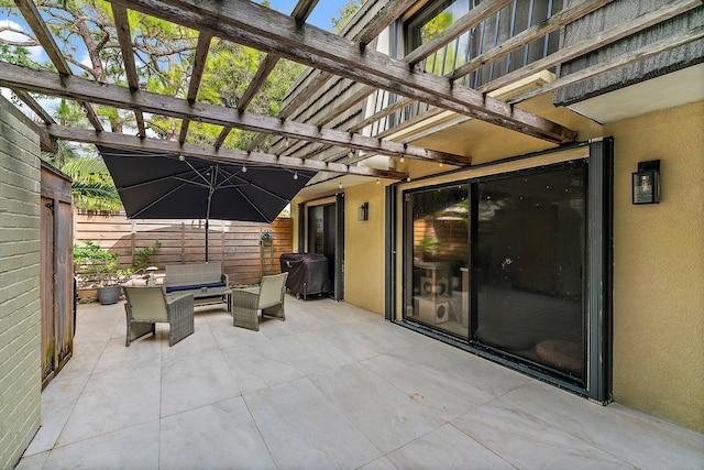 view of patio / terrace with a pergola and an outdoor hangout area