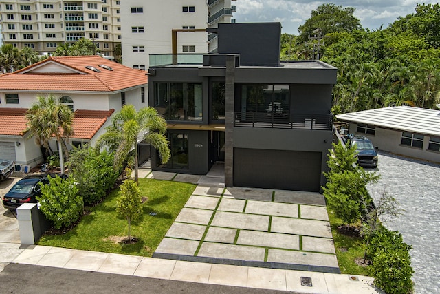 exterior space with a garage and a balcony