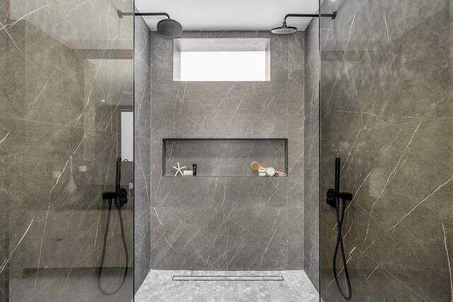 bathroom with a tile shower