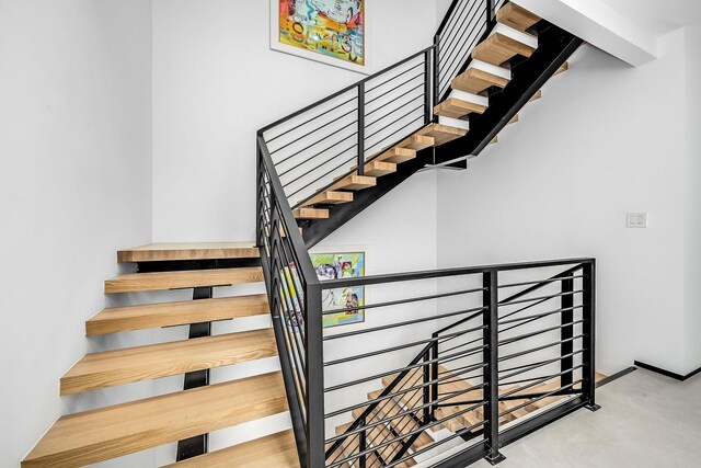 stairway with concrete floors