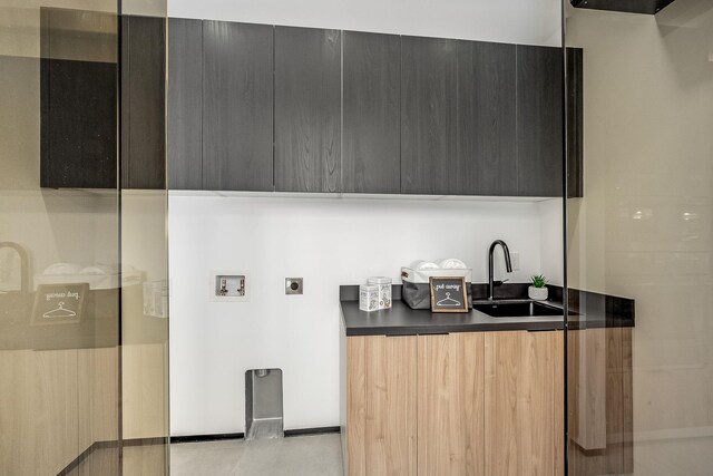 kitchen featuring light tile patterned floors and sink