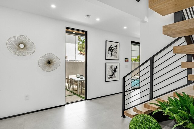 foyer featuring light tile patterned floors