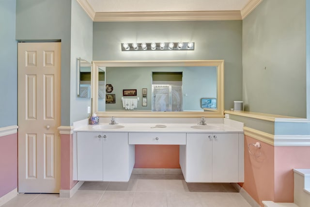 bathroom with ornamental molding, vanity, and tile patterned floors