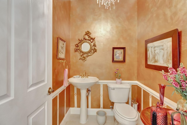 bathroom featuring tile patterned floors and toilet