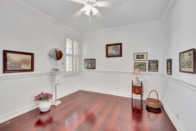 exercise area with ceiling fan, dark hardwood / wood-style floors, and ornamental molding