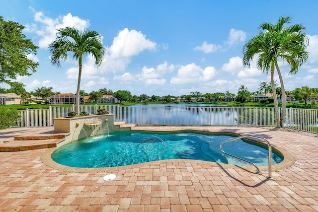 view of swimming pool with a patio area and pool water feature