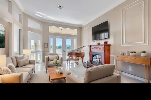 living room with french doors and crown molding