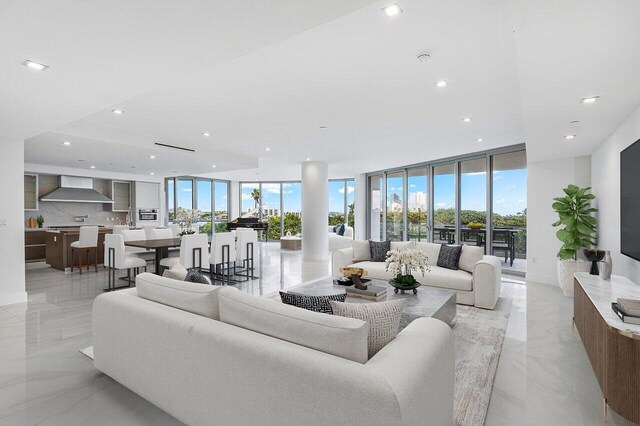 tiled living room featuring expansive windows