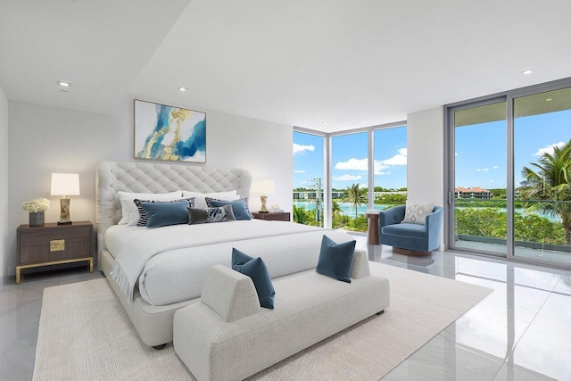 tiled bedroom featuring a wall of windows and access to outside