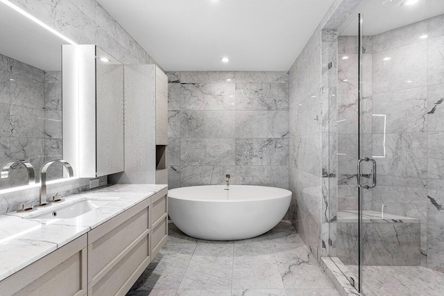 bathroom with vanity, tile walls, and tile patterned floors