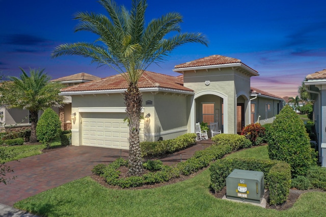 mediterranean / spanish-style house featuring a garage