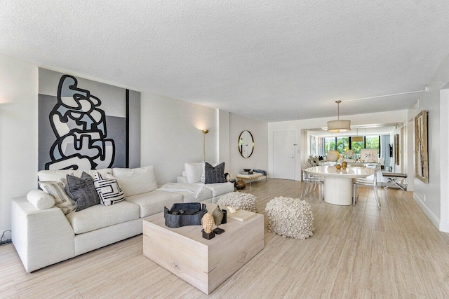 living room featuring a textured ceiling