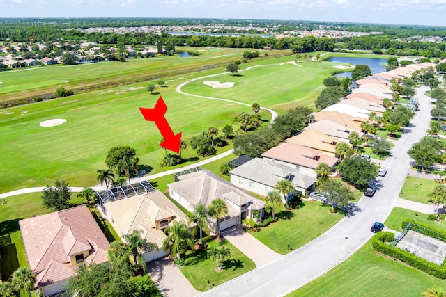 bird's eye view featuring golf course view, a residential view, and a water view