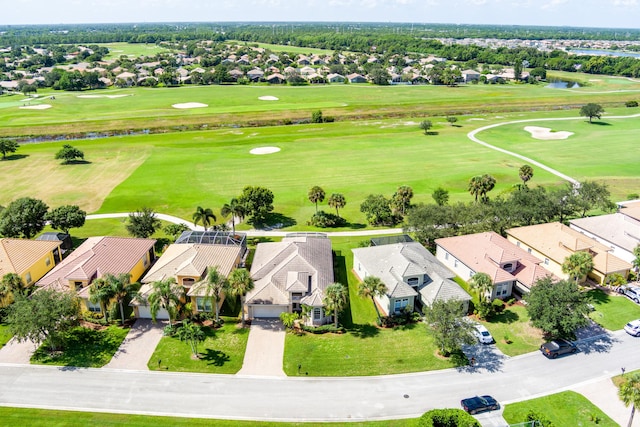 birds eye view of property featuring view of golf course and a residential view