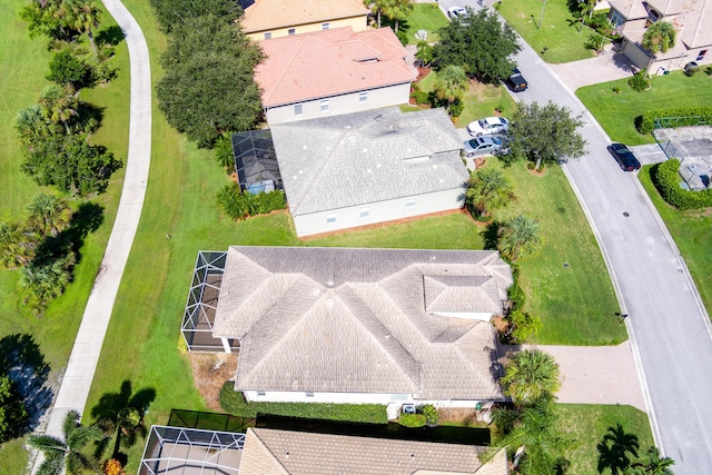 birds eye view of property with a residential view