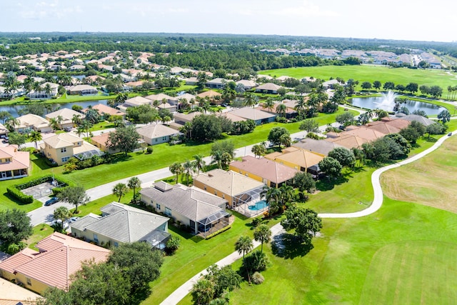 aerial view featuring a residential view, view of golf course, and a water view