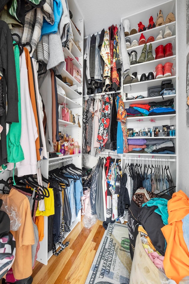 walk in closet featuring light hardwood / wood-style flooring