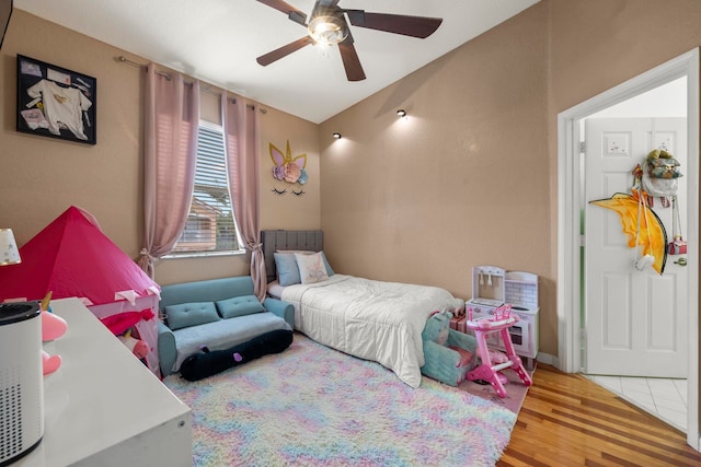 bedroom featuring ceiling fan and light wood-type flooring