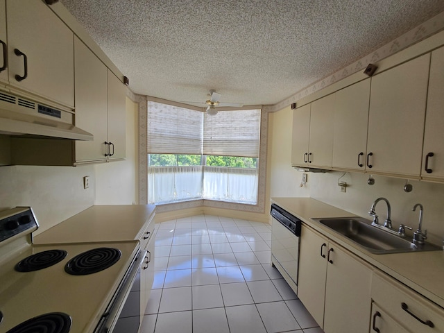 kitchen featuring ceiling fan, light tile patterned floors, sink, a textured ceiling, and white appliances