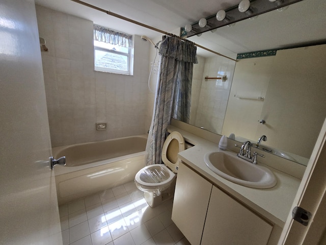 full bathroom featuring toilet, tile patterned flooring, vanity, and shower / tub combo with curtain