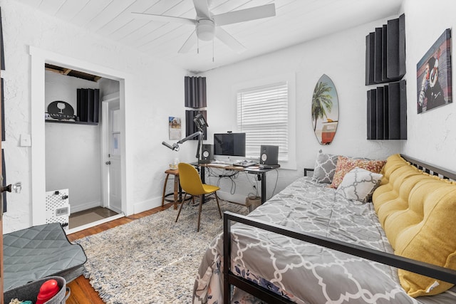 bedroom with ceiling fan and hardwood / wood-style floors