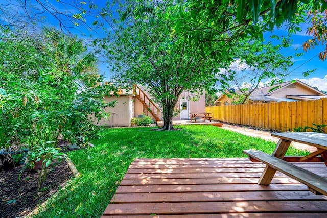 view of yard with a patio area and a deck