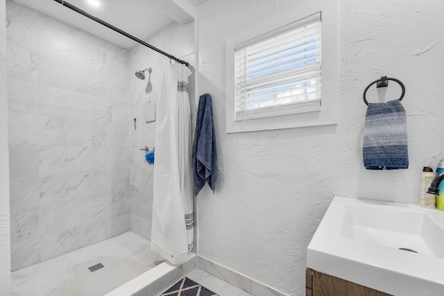 bathroom featuring vanity and curtained shower