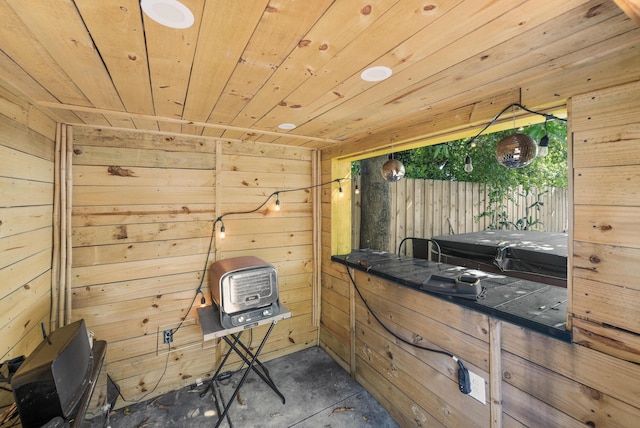 miscellaneous room with wood ceiling and wooden walls