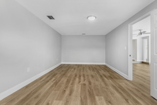 spare room with ceiling fan and light hardwood / wood-style flooring