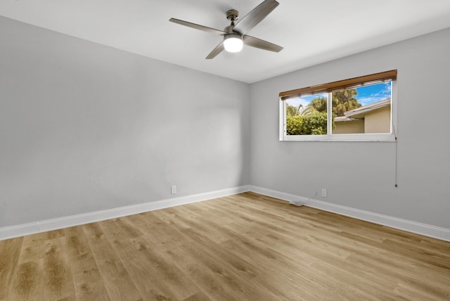 unfurnished room featuring light hardwood / wood-style floors and ceiling fan