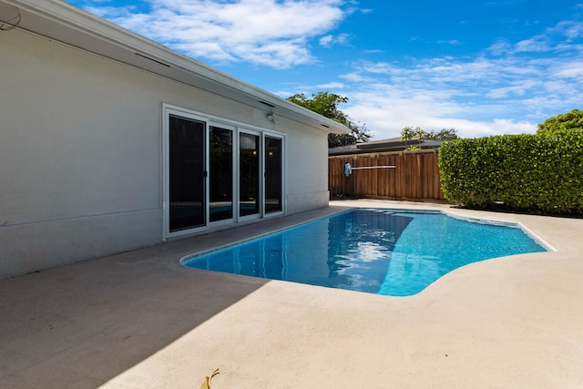 view of swimming pool with a patio