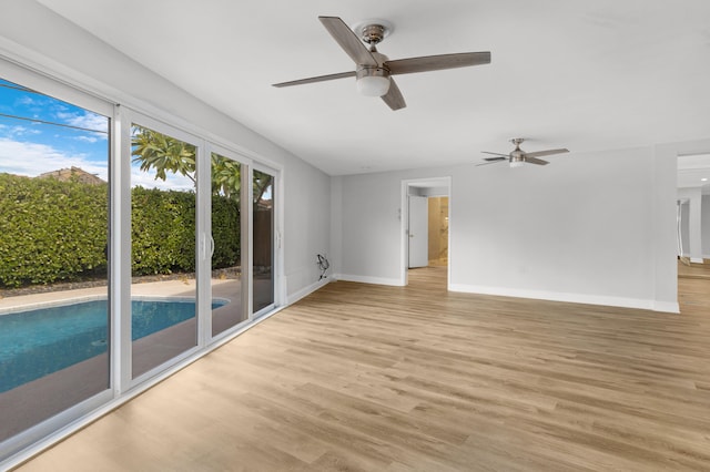 interior space featuring light wood-type flooring and ceiling fan