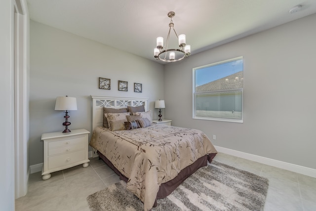 bedroom featuring a chandelier and light tile patterned floors