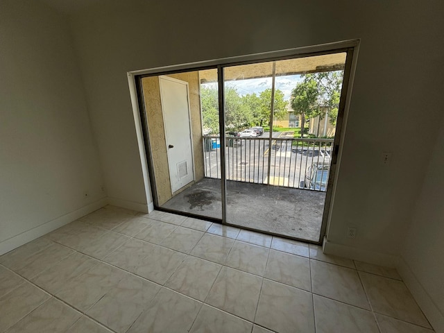 entryway featuring tile patterned flooring, visible vents, and baseboards