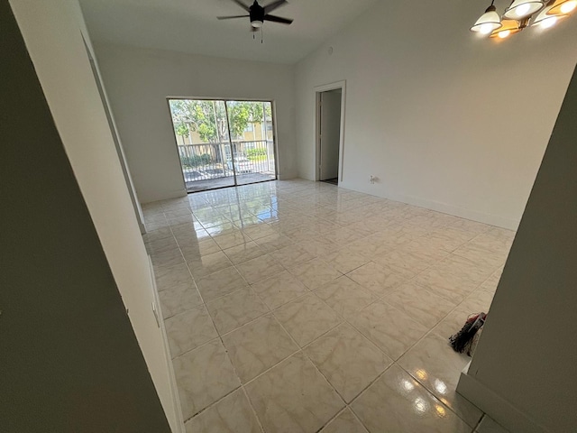 unfurnished room featuring high vaulted ceiling and a ceiling fan