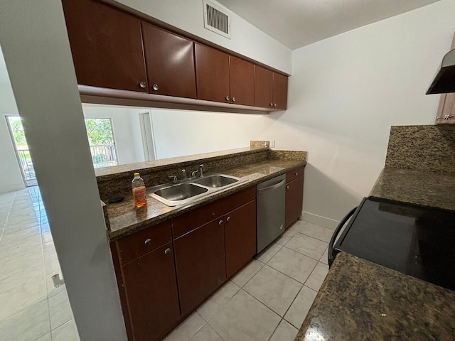 kitchen featuring light tile patterned floors, baseboards, visible vents, stainless steel dishwasher, and a sink