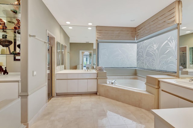 bathroom with separate shower and tub, tile patterned floors, and vanity