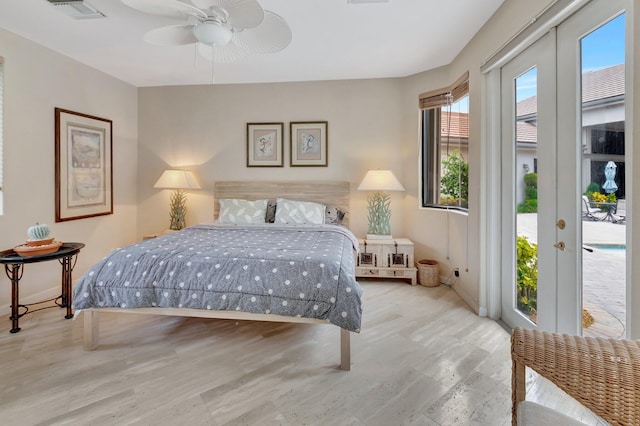 bedroom featuring ceiling fan, light wood-type flooring, french doors, and access to exterior