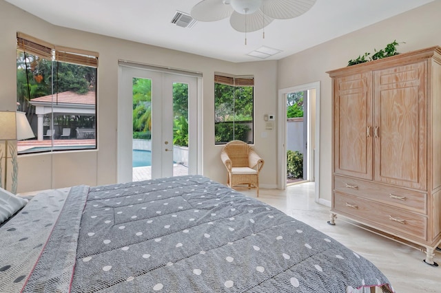 bedroom with ceiling fan, multiple windows, access to exterior, and french doors