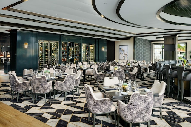 dining space featuring a tray ceiling