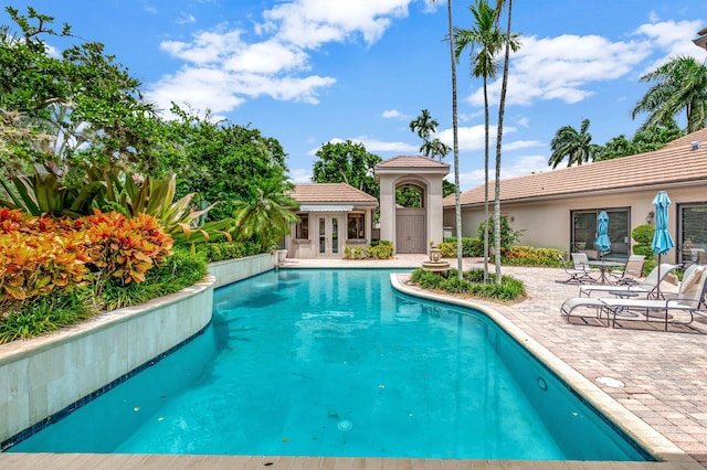 view of swimming pool with a patio area