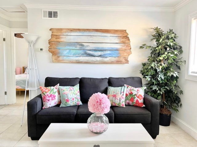 living room with crown molding and light tile patterned flooring