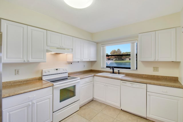 kitchen featuring white cabinets, light tile patterned flooring, white appliances, and sink