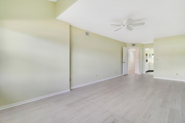 unfurnished room featuring light hardwood / wood-style flooring and ceiling fan