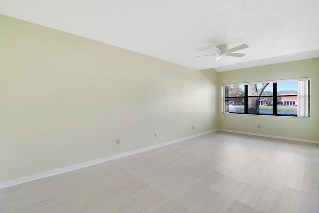 empty room with ceiling fan and light wood-type flooring