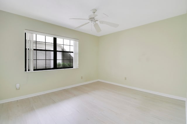 spare room featuring ceiling fan and light wood-type flooring